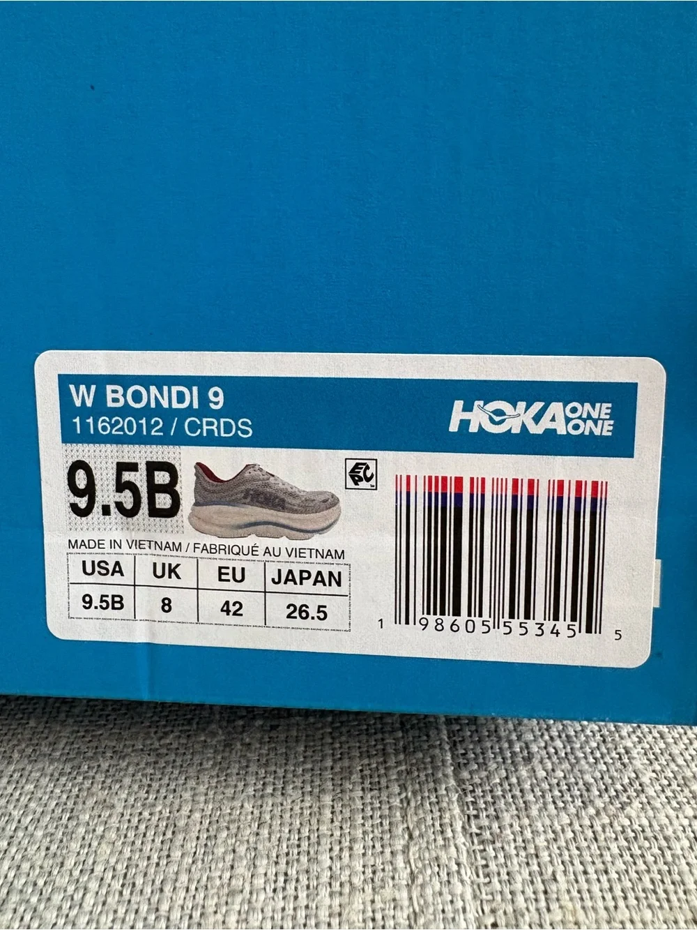 Hoka Women's Bondi 9 Light Gray Running Shoes with Red and Light Blue Accents